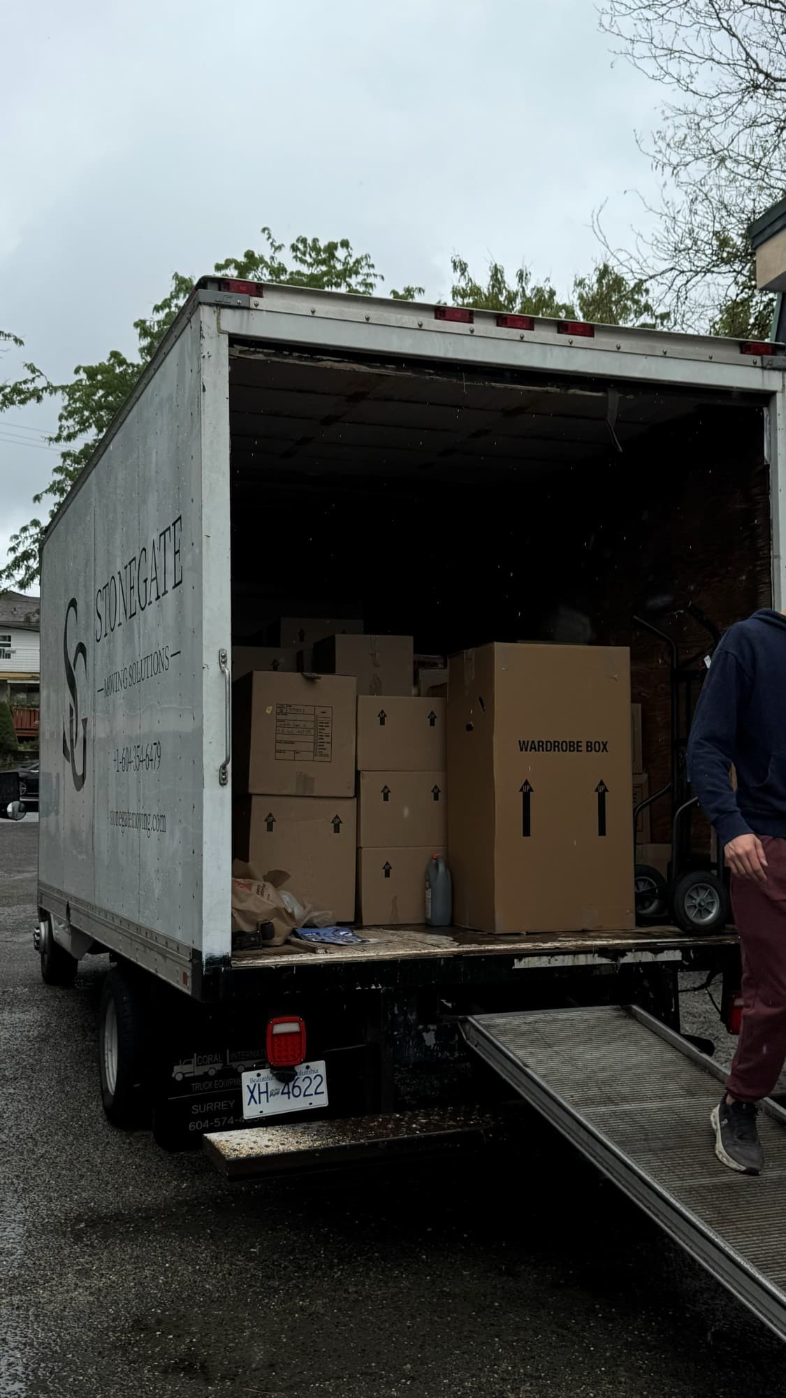Packed boxes and a wardrobe box loaded in the Stonegate truck