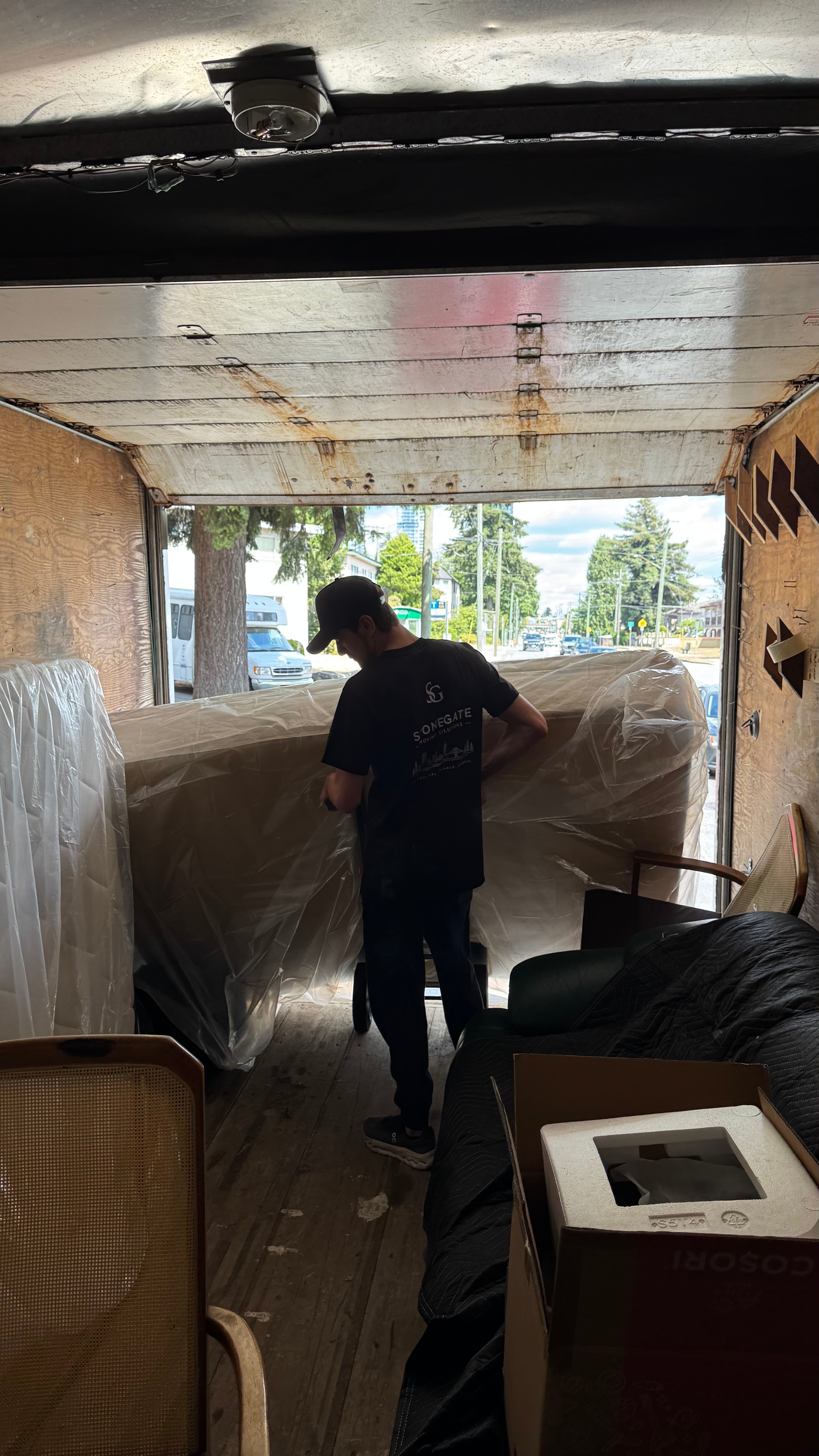 Stonegate crew wrapping and loading furniture into the truck