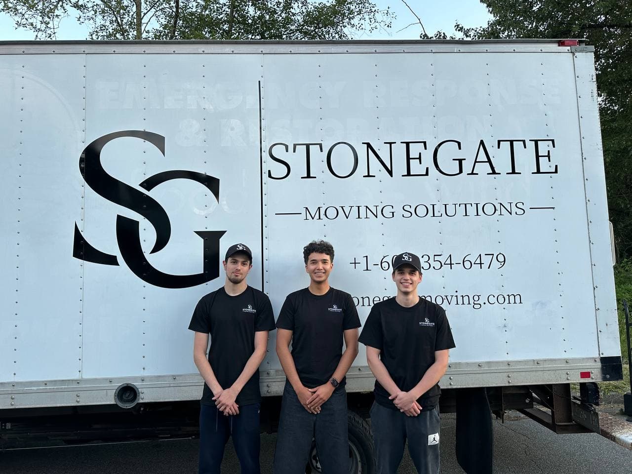 The Stonegate Moving Solutions crew in front of their truck
